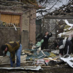 
              Local residents work to clean the debris from damaged house after Russian shelling in Kramatorsk, Ukraine, Thursday, Nov. 10, 2022. (AP Photo/Andriy Andriyenko)
            