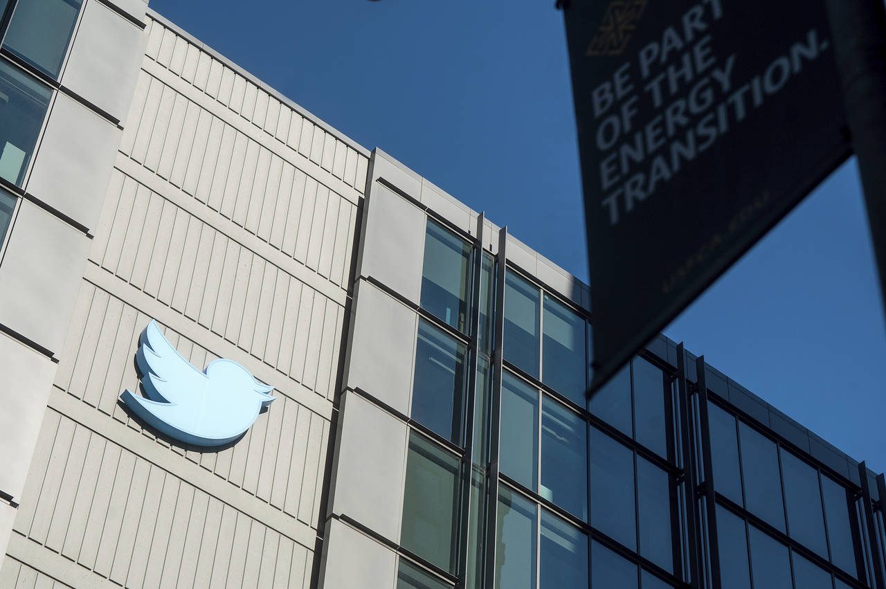 FILE - A Twitter logo hangs outside the company's San Francisco offices on Nov. 1, 2022. A top Euro...