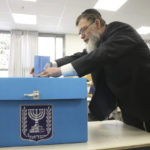 
              Ultra Orthodox Jew votes during Israel elections in Jerusalem, Tuesday, Nov. 1, 2022. (AP Photo/Oren Ziv)
            