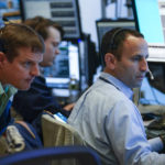 
              Traders work on the floor at the New York Stock Exchange in New York, Wednesday, Nov. 2, 2022. (AP Photo/Seth Wenig)
            