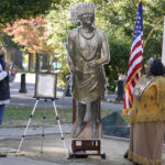 
              Jesse Tarango, left, chairman of Wilton Rancheria, and his mother Mary Tarango, second from right, look at an enlarged photo of a statue of the late William Franklin Sr. during a groundbreaking ceremony for a Native American monument at Capitol Park in Sacramento, Calif., Monday, Nov. 14, 2022. The actual statue of Franklin will replace a statue of Fr. Junipero Serra, whose statue was torn down by protesters in 2020. The new statue is expected to be placed in the park in early 2023. (AP Photo/Photo/Rich Pedroncelli)
            