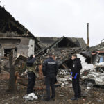 
              Police officers inspect destroyed apartment buildings after Russian shelling in Pokrovsk, Donetsk region, Ukraine, Friday, Nov. 4, 2022. (AP Photo/Andriy Andriyenko)
            