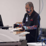 
              An election worker tabulates ballots inside the Maricopa County Recorders Office, Thursday, Nov. 10, 2022, in Phoenix. (AP Photo/Matt York)
            
