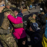 
              A Kherson resident hugs a Ukrainian defence force member in Kherson, southern Ukraine, Monday, Nov. 14, 2022. The retaking of Kherson was one of Ukraine's biggest successes in the nearly nine months since Moscow's invasion. (AP Photo/Bernat Armangue)
            