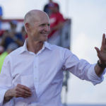 
              FILE - Sen. Rick Scott, R-Fla., arrives to speak before former President Donald Trump at a campaign rally in support of the campaign of Sen. Marco Rubio, R-Fla., at the Miami-Dade County Fair and Exposition on Nov. 6, 2022, in Miami. Scott is mounting a long-shot bid to unseat Senate Republican leader Mitch McConnell, a rare challenge for the longtime GOP stalwart after his party failed to win back the majority in the midterm elections. (AP Photo/Rebecca Blackwell, File)
            