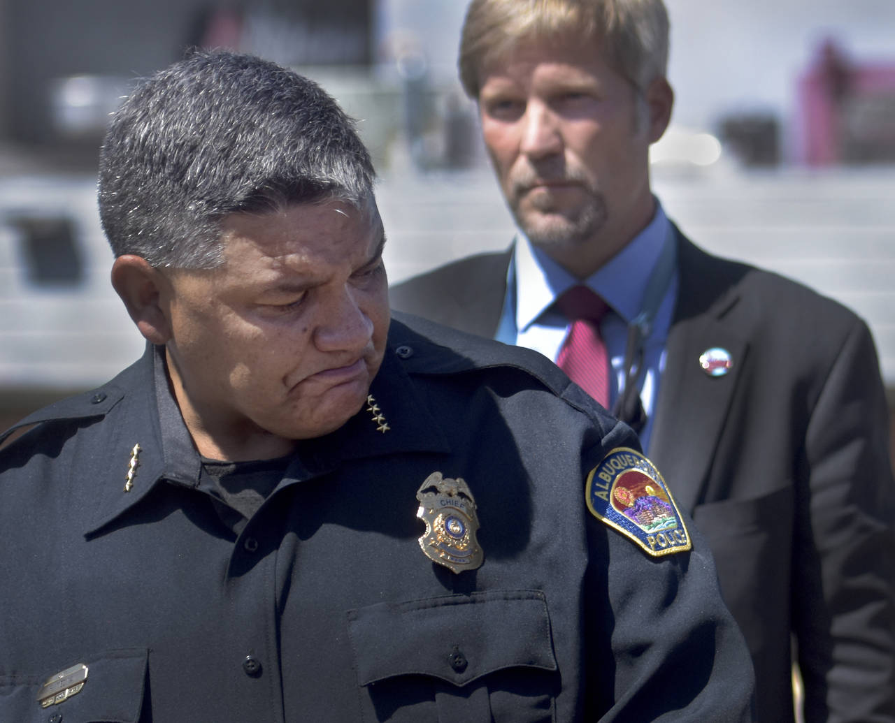 FILE - Albuquerque Police Department Police Chief Harold Medina reacts as he relays details of a sh...