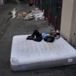 
              FILE - A homeless man sleeps on a discarded mattress in Los Angeles, Thursday, July 21, 2022. On Sunday, Dec. 18, 2022, Los Angeles Mayor Karen Bass said her administration will start moving homeless people in tent encampments into hotel and motel rooms through a new program that launches on Tuesday. (AP Photo/Jae C. Hong, File)
            