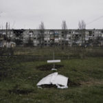 
              Recently dug graves of residents who died during shelling are seen in Soledar, Donetsk region, Ukraine, Wednesday, Dec. 21, 2022. (AP Photo/Libkos)
            