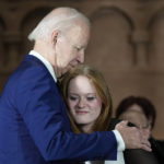 
              President Joe Biden hugs Sandy Hook survivor Jackie Hegarty before he speaks during an event in Washington, Wednesday, Dec. 7, 2022, with survivors and families impacted by gun violence for the 10th Annual National Vigil for All Victims of Gun Violence. (AP Photo/Susan Walsh)
            