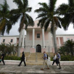 
              A handful of people, some crypto enthusiasts or FTX investors, wait to enter Magistrate Court to see a scheduled appearance by FTX founder Sam Bankman-Fried, in Nassau, Bahamas, Monday, Dec. 19, 2022. (AP Photo/Rebecca Blackwell)
            