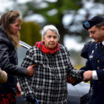 
              Patricia Lyons, 90, the only remaining sibling of U.S. Army Sgt. Alfred Sidney, is flanked by her daughter, Sara Hopkins, left, and New Hampshire Army National Guard Capt. Daniel Eastman, at Sidney's burial service in Littleton, N.H., on Thursday, Dec. 8, 2022. The remains of Sidney, who went missing during the Korean War in 1951 and was later reported to have died in a prisoner of war camp, were recently identified and brought back home. (Robert Blechl/Caledonian-Record via AP)
            