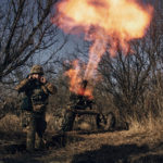 
              FILE - Ukrainian soldiers fire French MO-120-RT-61 120 mm rifled towed mortar at Russian positions in the frontline near Bakhmut, Donetsk region, Ukraine, Tuesday, Dec. 6, 2022. With the war in Ukraine grinding through its 10th month, both sides are locked in a stalemated battle of attrition, which could set the stage for a new round of escalation. (AP Photo/LIBKOS, File)
            