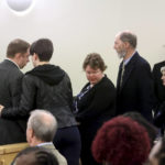 
              Aaron Dean, left, speaks with his family before the start of the sentencing phase of his trial at Tarrant County's 396th District Court on Friday, Dec. 16, 2022, in Fort Worth, Texas. Dean, a former Fort Worth police officer, was found guilty of manslaughter in the 2019 shooting death of Atatiana Jefferson. (Amanda McCoy/Star-Telegram via AP, Pool)
            