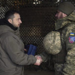 
              In this photo provided by the Ukrainian Presidential Press Office, Ukrainian President Volodymyr Zelenskyy, left, awards a serviceman during his visit to Sloviansk, Donbas region, Ukraine, Tuesday, Dec. 6, 2022. (Ukrainian Presidential Press Office via AP)
            