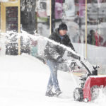 
              John Strokowski plows snow off a sidewalk outside in Buffalo, N.Y.'s Elmwood Village on Monday, Dec. 26, 2022. Clean up is currently under way after a blizzard hit four Western New York counties. (Joseph Cooke/The Buffalo News via AP)
            