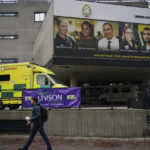 
              A man walks past Waterloo ambulance station as paramedics, ambulance technicians and call handlers in England and Wales take strike action in England and Wales, in London, Wednesday, Dec. 21, 2022.  Thousands of ambulance workers in Britain are staging a 24-hour strike, with unions and the government swapping accusations of blame for putting lives at risk. The government is telling people not to play contact sports, take unnecessary car trips or get drunk in order to reduce their risk of needing an ambulance on Wednesday. (Victoria Jones/PA via AP)
            