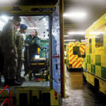 
              Military personnel from the Household Division receive training in an ambulance, at Wellington Barracks as they prepare to provide cover for ambulance workers on Dec. 21 and 28 when members of the Unison, GMB and Unite unions take industrial action over pay, in London, Tuesday, Dec. 20, 2022. (Victoria Jones/PA via AP)
            