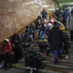 
              People rest in the subway station, being used as a bomb shelter during a rocket attack in Kyiv, Ukraine, Friday, Dec. 16, 2022. Ukrainian authorities reported explosions in at least three cities Friday, saying Russia has launched a major missile attack on energy facilities and infrastructure. Kyiv Mayor Vitali Klitschko reported explosions in at least four districts, urging residents to go to shelters. (AP Photo/Efrem Lukatsky)
            