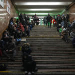 
              People rest in a subway station, being used as a bomb shelter during a rocket attack in Kyiv, Ukraine, Friday, Dec. 16, 2022. Ukrainian authorities reported explosions in at least three cities Friday, saying Russia has launched a major missile attack on energy facilities and infrastructure. Kyiv Mayor Vitali Klitschko reported explosions in at least four districts, urging residents to go to shelters. (AP Photo/Efrem Lukatsky)
            