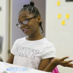 
              Fourth grader Gi'Shiya Brogan gestures during an interview at an after school program at a community center Thursday, Nov. 17, 2022, in Hopewell, Va. “I need help with subtraction,” said Gi’Shiya. “If the bigger number is not on top, I get really confused.” The schools in Hopewell, Va., went to a year-round schedule in 2021. (AP Photo/Steve Helber)
            