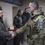 
              In this photo provided by the Ukrainian Presidential Press Office, Ukrainian President Volodymyr Zelenskyy, left, awards a serviceman during his visit to Sloviansk, Donbas region, Ukraine, Tuesday, Dec. 6, 2022. (Ukrainian Presidential Press Office via AP)
            