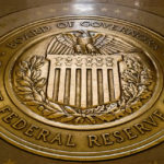 
              FILE- In this Feb. 5, 2018, file photo, the seal of the Board of Governors of the United States Federal Reserve System is displayed in the ground at the Marriner S. Eccles Federal Reserve Board Building in Washington.  The Federal Reserve reinforced its inflation fight Wednesday, Dec. 14, 2022, by raising its key interest rate for the seventh time this year and signaling more hikes to come. But the Fed announced a smaller hike than it had in its past four meetings at a time when inflation is showing signs of easing. (AP Photo/Andrew Harnik, File)
            