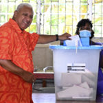 
              Fiji's Prime Minister and FijiFirst leader Frank Bainimarama votes the general election in Suva, Fiji, Wednesday, Dec. 14, 2022. Fijians voted Wednesday in an election that pitted two former military coup leaders against each other at a time the nation is trying to recover from a severe economic downturn. (Mick Tsikas/AAP Image via AP)
            