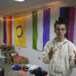 
              Sean Fisher, one of the student coordinators for QPLUS, the LGBTQ student organization for the College of Saint Benedict and Saint John's University, stands in the organization's dedicated lounge on the college's campus in St. Joseph, Minn., on Tuesday, Nov. 8, 2022. To Fisher, a senior in environmental studies who identifies as non-binary, the Catholic colleges' recognition and funding of the organization represents a new era. (AP Photo/Giovanna Dell'Orto)
            