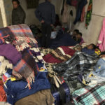 
              Migrants seek refuge from winter weather in a crowded shelter near the U.S. border in Ciudad Juárez, Mexico, on Thursday, Dec. 22, 2022. Hundreds of migrants are gathered in unusually frigid cold temperatures along the Mexican-U.S. border near El Paso, Texas, awaiting a U.S. Supreme Court decision on whether and when to lift pandemic-era restrictions that prevent many from seeking asylum. (AP Photo/Morgan Lee)
            