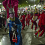 
              Dancers from Elotepec, in Veracruz state, perform as they arrive to the Basilica of Guadalupe in Mexico City, early Monday, Dec. 12, 2022. Devotees of the Virgin of Guadalupe make the pilgrimage for her Dec. 12 feast day, the anniversary of one of several apparitions of the Virgin Mary witnessed by an Indigenous Mexican man named Juan Diego in 1531. (AP Photo/Aurea Del Rosario)
            