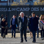 
              French President Emmanuel Macron, right, and Camp des Milles foundation President Alain Chouraqui visit the Camp des Milles memorial site in Aix-en-Provence, southern France, Monday, Dec.5, 2022. French President Emmanuel Macron visits a Nazi internment and deportation camp near Avignon, giving warnings about hate speech and resurgent of antisemitism. (Christophe Simon, Pool via AP)
            
