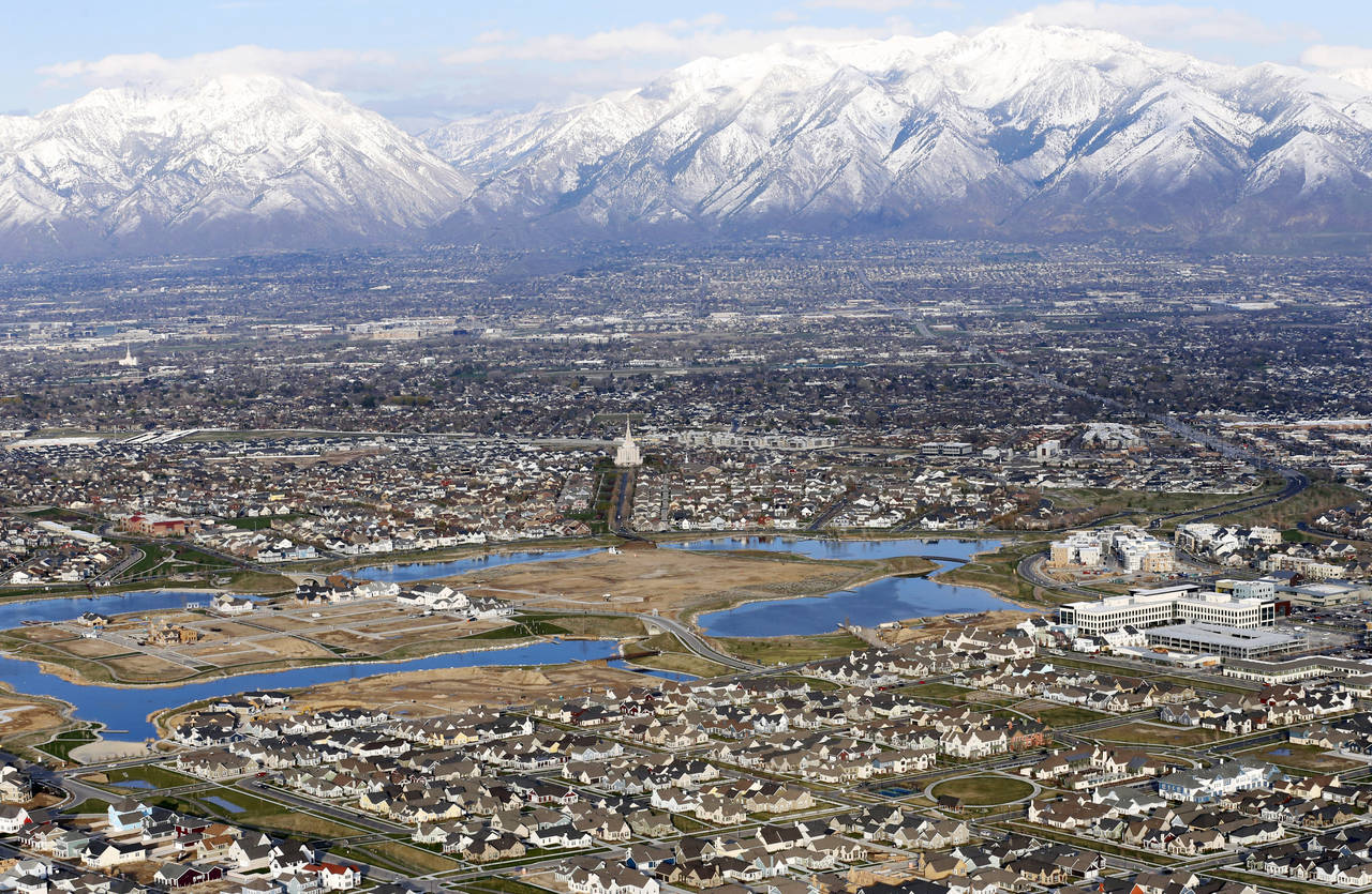 FILE - Homes in suburban Salt Lake City are shown, April 13, 2019. According to estimates released ...