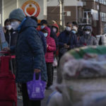 
              Residents wearing face masks stand in line to enter a supermarket which controls the flow of shoppers in Beijing, Thursday, Dec. 1, 2022. More cities eased anti-virus restrictions as Chinese police tried to head off protests Thursday while the ruling Communist Party prepared for the high-profile funeral of the late leader Jiang Zemin. (AP Photo/Andy Wong)
            