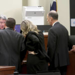 
              Judge George Gallagher talks to the the state and defense attorneys during the first day of the murder trial of former Fort Worth Police Officer Aaron Dean on Monday, Dec. 5, 2022, in Fort Worth, Texas. From left, Assistant Tarrant County Criminal District Attorney R. Dale Smith, Assistant Criminal District Attorney Ashlea Deener, defense attorney Bob Gill and defense attorney Miles Brissette. Dean fatally shot Atatiana Jefferson, a Black woman, through a window of her own Fort Worth home during a police call in 2019. (Amanda McCoy/Star-Telegram via AP, Pool)
            