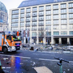 
              Debris lay on the street after a huge fish tank burst at the Seal Life Aquarium in central Berlin, Germany, Friday, Dec. 16, 2022. (Christoph Soeder/dpa via AP)
            