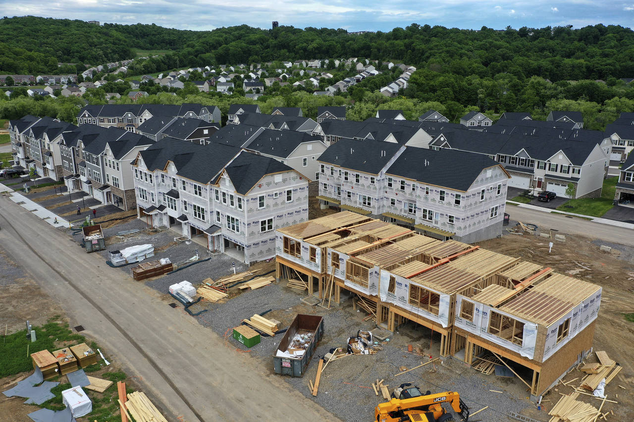 FILE - Houses under construction are seen in Mars, Pa., on May, 27, 2022. Homebuilders have pumped ...