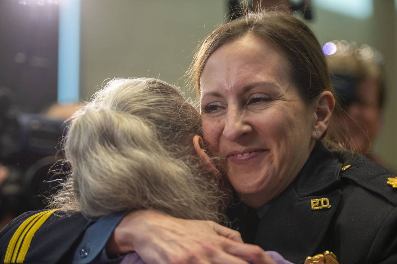 Stacey Graves, right hugs colleagues after she was selected by the Kansas City Board of Police Comm...