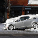 
              A car sits buried under snow, Wednesday, Dec. 28, 2022, in Buffalo N.Y., following a winter storm. (AP Photo/Jeffrey T. Barnes)
            