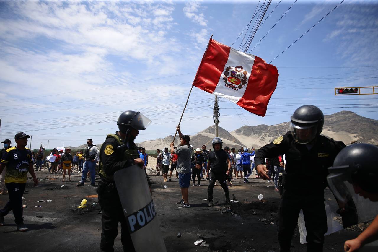 Supporters of ousted Peruvian President Pedro Castillo protest on the Pan-American North Highway wh...