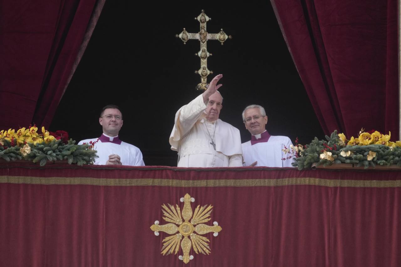 Pope Francis waves to faithful at the end of the Urbi et Orbi (Latin for 'to the city and to the wo...