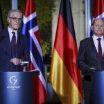 
              Norway's Prime Minister Jonas Gahr Store, left, and German Chancellor Olaf Scholz brief the media during a joint news conference after a meeting at the chancellery in Berlin, Germany, Wednesday, Nov. 30, 2022. (Kay Nietfeld/dpa via AP)
            
