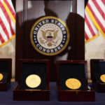 
              Congressional Gold Medals are placed before a ceremony honoring law enforcement officers who defended the U.S. Capitol on Jan. 6, 2021, in the U.S. Capitol Rotunda in Washington, Tuesday, Dec. 6, 2022. (AP Photo/Alex Brandon)
            