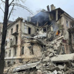 
              Debris of an apartment building damaged in a Russian rocket attack in Kryvyi Rih, Ukraine, Friday, Dec. 16, 2022. Russian forces launched at least 60 missile strikes across Ukraine on Friday, officials said, reporting explosions in at least four cities. At least two people were killed when a residential building was hit in central Ukraine, while electricity and water services were interrupted in the two largest cities, Kyiv and Kharkiv. (Ukrainian Emergency Service via AP Photo)
            