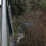 
              Part of a blue bus is seen after it plunged into a river near Pontevedra in northwestern Spain, Sunday, Dec. 25, 2022. Authorities say rescuers have recovered the victims from the bus that ran off a bridge and plunged into the river on Christmas Eve, killing six passengers and injuring the driver and another passenger. The Spanish Guardia Civil says a total of eight people were on the bus. The two survivors were rescued Saturday night and taken to hospitals. The bodies of the dead were retrieved Sunday. (Cesar Arxina/Europa Press via AP)
            