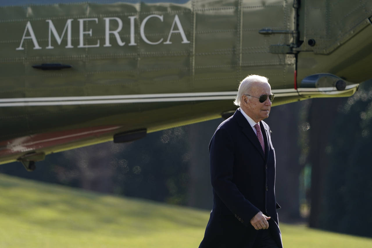President Joe Biden walks on the South Lawn of the White House after stepping off Marine One, Monda...