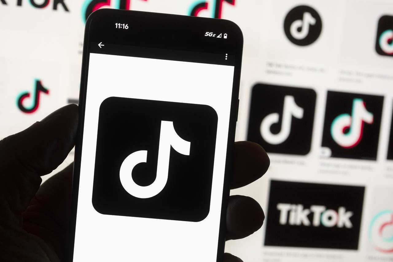 FILE - The TikTok logo is seen on a cell phone on Oct. 14, 2022, in Boston. TikTok would be banned ...