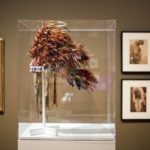 
              FILE - A Native American feather bonnet from 1890 made of eagle feathers, rooster hackles, wood rods, porcupine hair, wool cloth, felt, and glass beads, is displayed as part of the exhibition, "Go West! Art of the American Frontier from the Buffalo Bill Center of the West," at the High Museum of Art on Oct. 31, 2013, in Atlanta. Federal penalties have increased under a newly signed law Wednesday, Dec. 21, 2022, intended to protect the cultural patrimony of Native American tribes. (AP Photo/David Goldman, File)
            