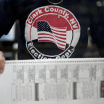 
              FILE - An election worker tabulates mail-in ballots at the Clark County Election Department on Nov. 9, 2022, in Las Vegas. Republicans are re-evaluating their antipathy to mail voting. After former President Donald Trump condemned that method of casting ballots in 2020, conservatives shied away from it. That's given Democrats a multiweek jump on voting during elections. (AP Photo/Gregory Bull, File)
            
