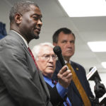 
              Mississippi Commissioner of Corrections Burl Cain, center, holds the microphone as Jeworski Mallett, Deputy Commissioner of Institution, left, answers a question about the final words spoken by inmate Thomas Edwin Loden Jr., prior to his execution, Wednesday, Dec. 14, 2022, at the Mississippi State Penitentiary in Parchman, Miss. Loden was executed for the rape and murder of a 16-year-old girl. (AP Photo/Rogelio V. Solis)
            