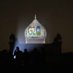 
              Archaeological Survey of India workers project the logo of G20 on to Safdarjung's tomb, in New Delhi, Thursday, Dec. 1, 2022. Around 100 monuments, including UNESCO world heritage sites across India will be lit up from Thursday for a week to mark India's presidency of G20, officials said. (AP Photo/Manish Swarup)
            
